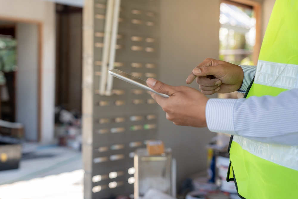 Tenant inspecting an apartment before renting in Ajman – OPlus Realty