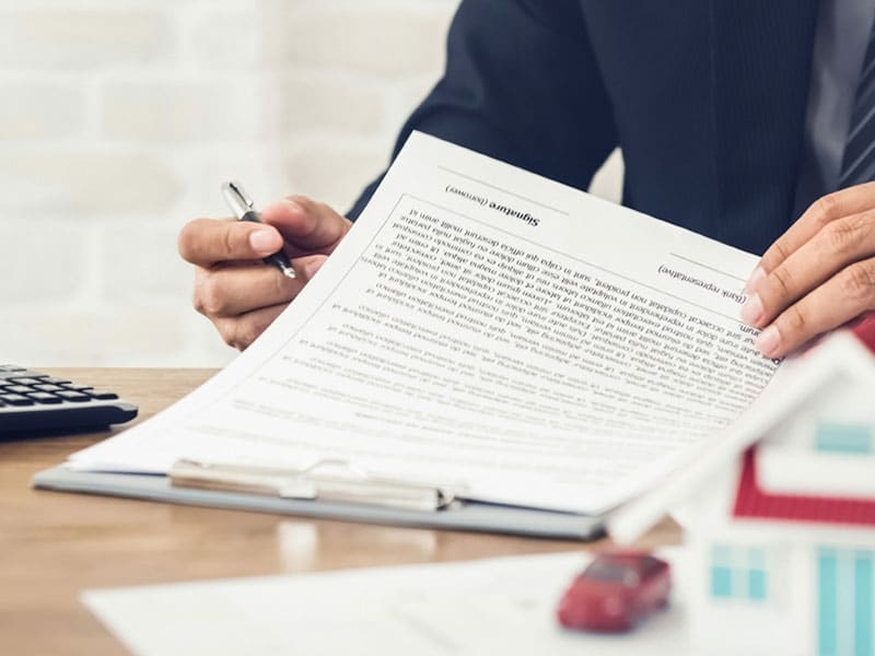 Tenant signing a rental contract in Ajman – OPlus Realty